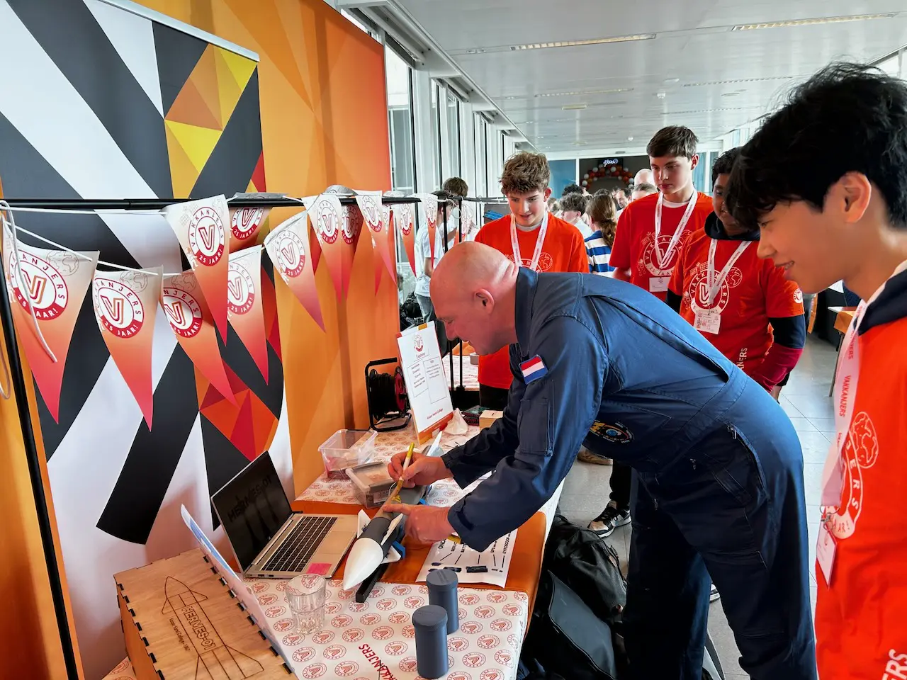 André Kuipers autographing the Hermes-01 rocket at Vakkanjers Explorer
